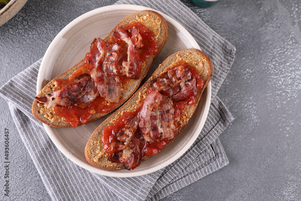 Sandwiches with peanut butter, strawberry jam and bacon Sandwiches with peanut butter, strawberry jam and bacon