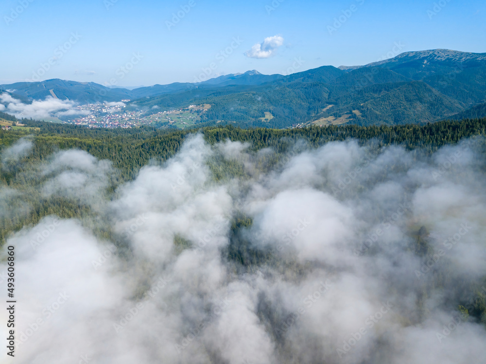 Obraz premium Morning fog in the Ukrainian Carpathians. Aerial drone view.