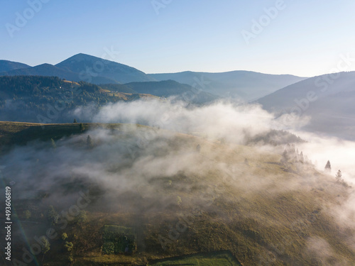 Morning fog in the Ukrainian Carpathians. Aerial drone view.