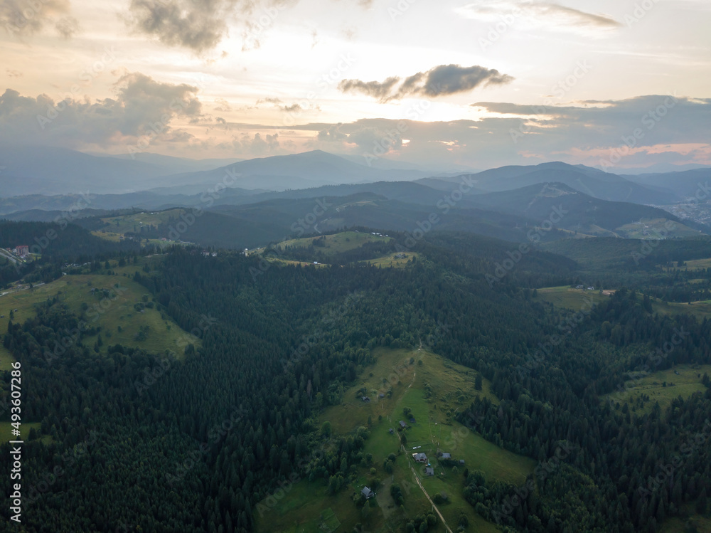 Fototapeta premium Sunset over the mountains in the Ukrainian Carpathians. Evening. Aerial drone view.
