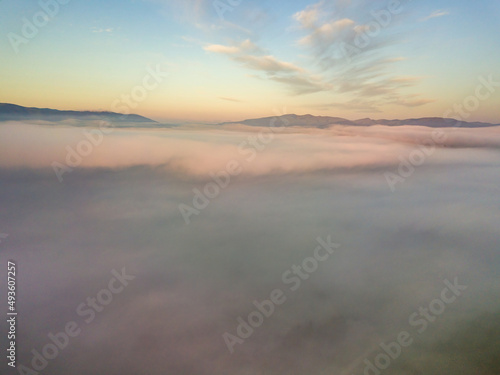 Wallpaper Mural The rays of dawn over the fog in the Ukrainian Carpathians. Aerial drone view. Torontodigital.ca