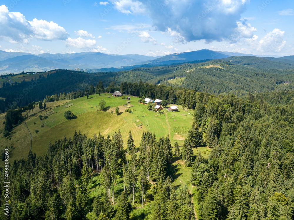 Green mountains of Ukrainian Carpathians in summer. Sunny day. Aerial drone view. Green mountains of Ukrainian Carpathians in summer. Sunny day. Aerial drone view.
