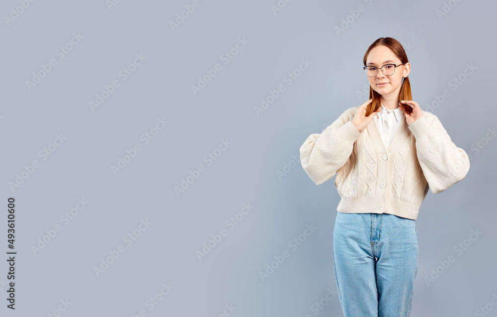 Young funny woman in casual clothes posing isolated over gray background. Young funny woman in casual clothes posing isolated over gray background.