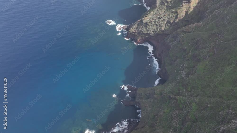 Mountain aerial of cliffs, high mountains, along the Atlantic coast line. Panoramic beautiful rough sea and green rocky nature landscape. Hiking paradise. Tenerife, spain, europe. Mountain aerial of cliffs, high mountains, along the Atlantic coast line. Panoramic beautiful rough sea and green rocky nature landscape. Hiking paradise. Tenerife, spain, europe.