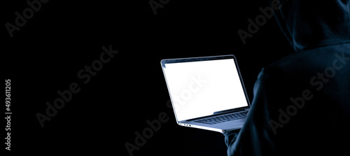 Fototapeta Naklejka Na Ścianę i Meble -  Cyber security hacker concept. Internet web hack technology. Digital laptop in hacker man hand isolated on black banner. Data protection, secured internet access, cybersecurity.