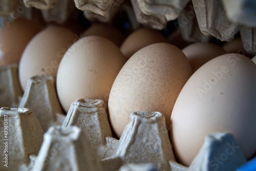 eggs in a cardboard box in the kitchen in the daylight