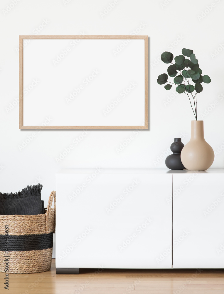 Blank picture frame mockup on white wall. Template for painting or poster.  White living room interior design. View of modern rustic style interior  with artwork mock-up Stock Photo | Adobe Stock