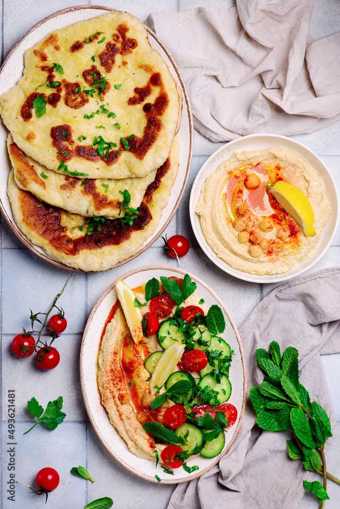 Hummus with fresh vegetable salad. top view . Hummus with fresh vegetable salad. top view .