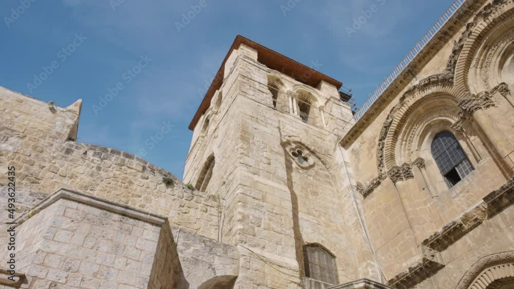 Low angle view of the Church of the Holy Sepulchre in Old Jerusalem - the holiest place for Christians. Slow motion, dolly shot. Low angle view of the Church of the Holy Sepulchre in Old Jerusalem - the holiest place for Christians. Slow motion, dolly shot.
