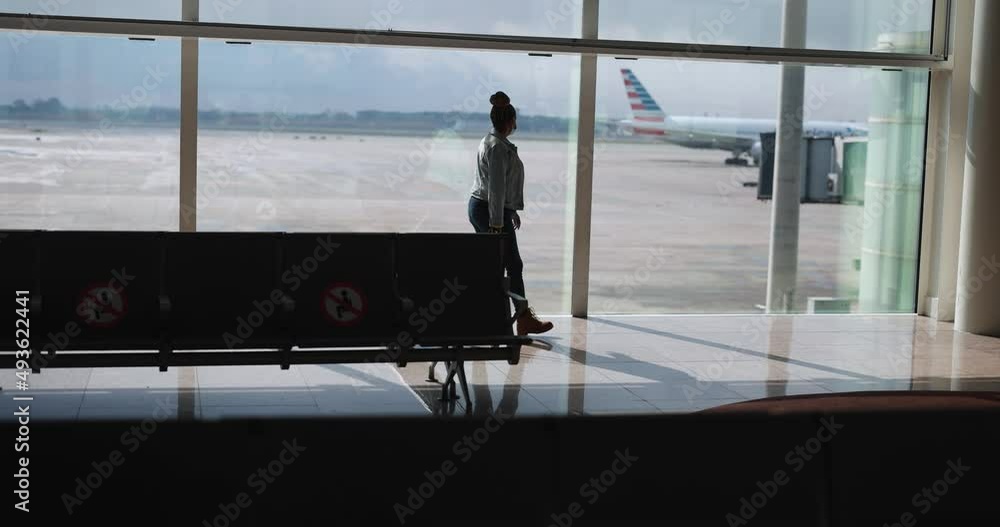 Mature african woman wearing safety face mask inside the international airport Mature african woman wearing safety face mask inside the international airport