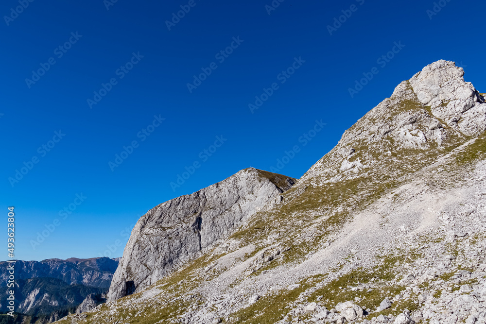Panoramic view on the mountain peaks of the Hochschwab Region in Upper Styria, Austria. Massiv sharp and high rock wall in the Alps in Europe. Climbing tourism, wilderness. Concept freedom. Limestone