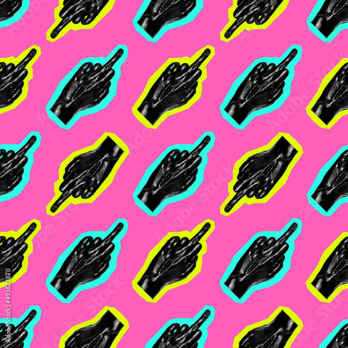 Fotografie Seamless texture with female hand painted black and showing aggressive gesture with the middle finger on a pink background