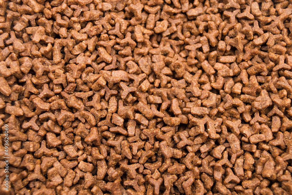 Dried cat food for animails as an abstract background brown texture Dried cat food for animails as an abstract background brown texture