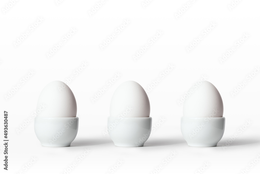 Egg in stand. All in white. Egg in stand. All in white.
