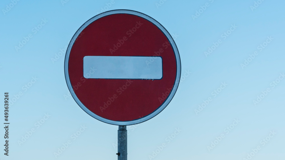 Road sign in the form of a white rectangle in a red circle. No entry. A red round sign warns: entrance forbidden. Road sign in the form of a white rectangle in a red circle. No entry. A red round sign warns: entrance forbidden.
