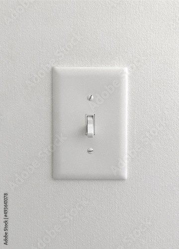 white light switch on painted wallpaper wall
