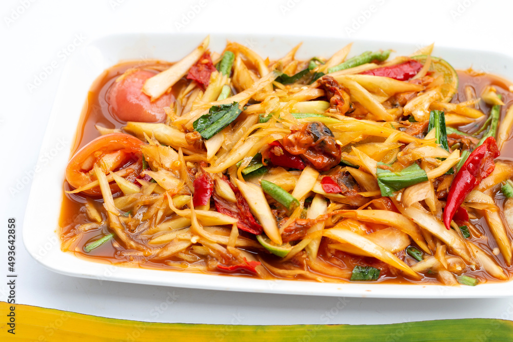 Spicy papaya salad with pickled shells