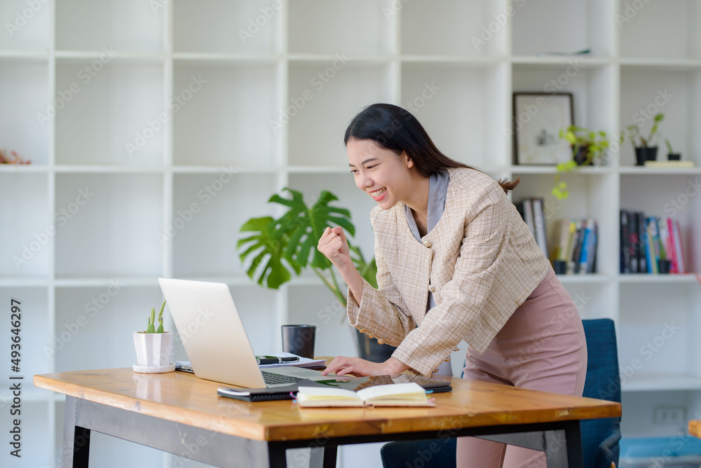 Successful young Asian businesswoman at work that achieve their goals. Successful young Asian businesswoman at work that achieve their goals.