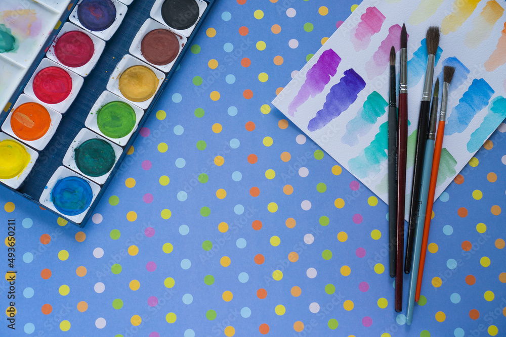 Paints and brushes for drawing on a bright background Paints and brushes for drawing on a bright background
