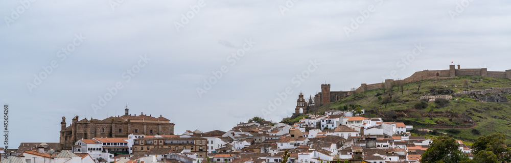 panorama view of the whitewashed Andalusian town of Aracena with its church and castle