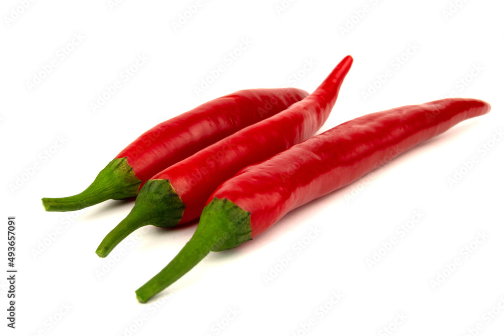 Three Red chili peppers isolated on a white background