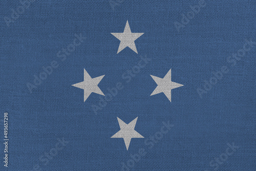 Patriotic textile background in colors of national flag. Federated States of Micronesia