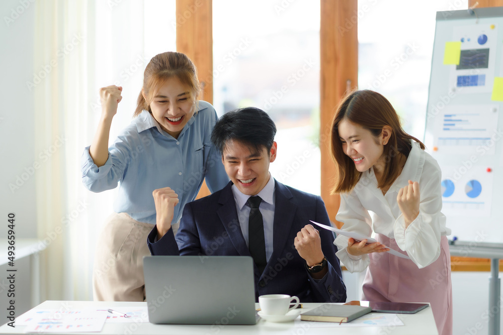 Group young Asian business people with the creative successful excited raised hands rejoicing. Group young Asian business people with the creative successful excited raised hands rejoicing.