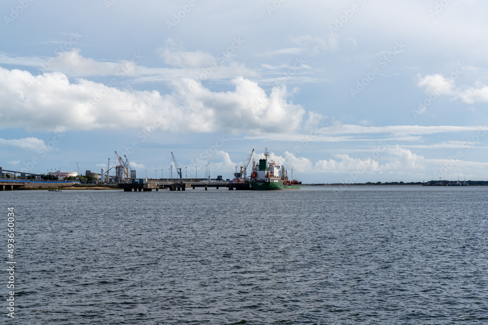 cargo ship being loaded at the industrial port of Huelva on the Odiel River estuary