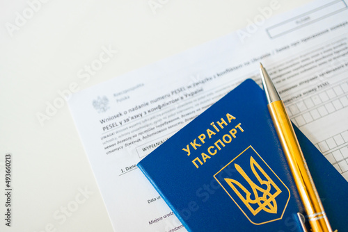 PESEL document, Ukrainian passport on white background.