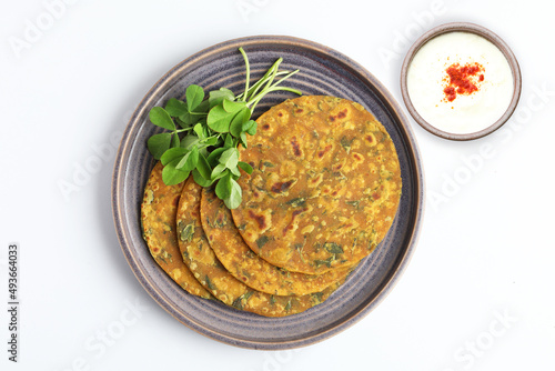 Indian flat bread,Methi Paratha,an Indian flatbread stuffed with fenugreek leaves and spices served with yogurt in breakfast or brunch  photo