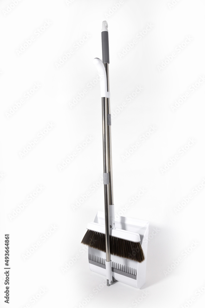 Combined White Set Broom and Scoop. Long handle and soft brush. Durable Plastic. Stainless steel. Housing. Scoop. Brush. Telescopic tubes. White background. Combined White Set Broom and Scoop. Long handle and soft brush. Durable Plastic. Stainless steel. Housing. Scoop. Brush. Telescopic tubes. White background.