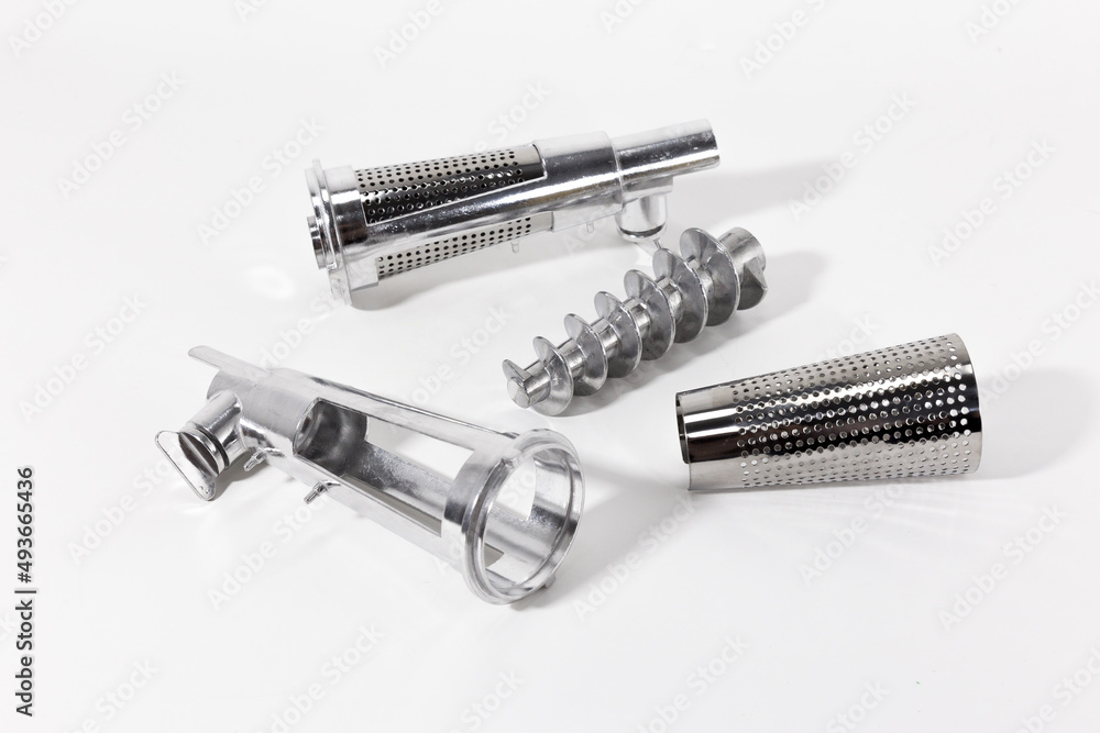 Meat grinder juicer attachment. Stainless steel. Collapsible. Juice attachment. White background. Meat grinder juicer attachment. Stainless steel. Collapsible. Juice attachment. White background.