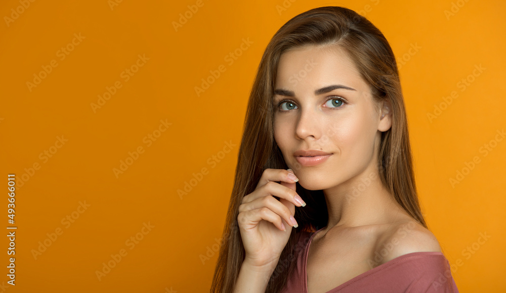 Beautiful young smiling woman with clean perfect fresh skin and long hair. Woman portrait of beauty model with natural make-up, formed eyebrows and long eyelashes. Spa, skincare and wellness Beautiful young smiling woman with clean perfect fresh skin and long hair. Woman portrait of beauty model with natural make-up, formed eyebrows and long eyelashes. Spa, skincare and wellness