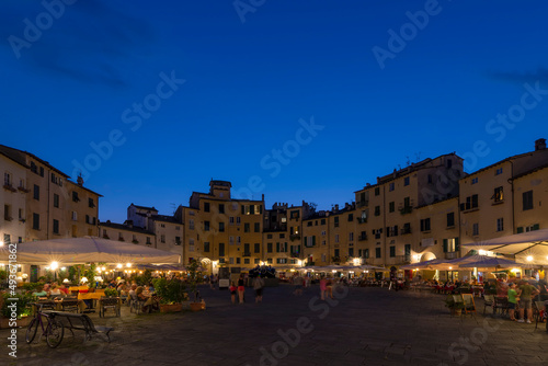 Beautiful view of Piazza dell'Anfiteatro square at twilight, Lucca, Tuscany, Italy