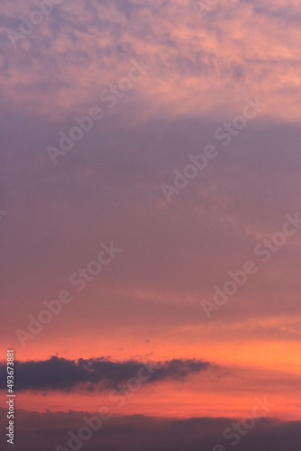glowing clouds on the red sky in evening light. dramatic weather in summer at dusk © Pellinni