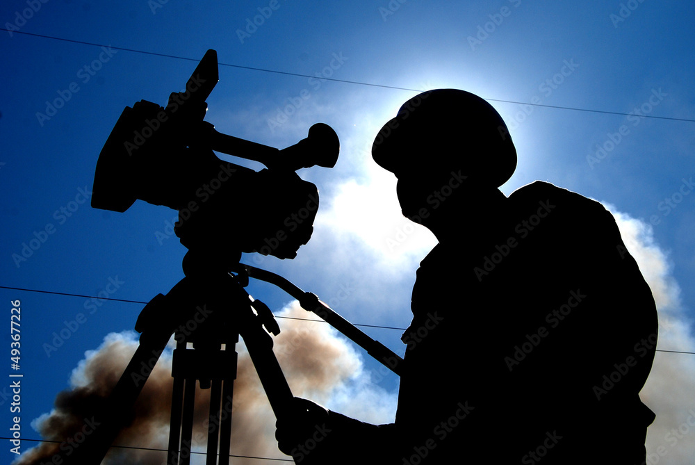 silhouette of cameramen with camera