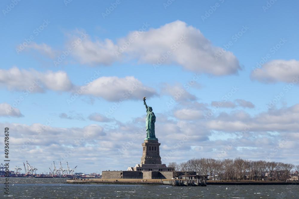 The Statue of Liberty in New York against a blue sky The Statue of Liberty in New York against a blue sky