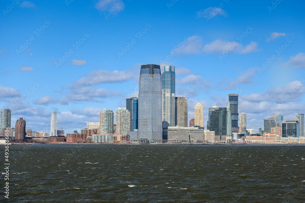 Views of Battery Park and the financial district from the water and Ellis Island in New York City