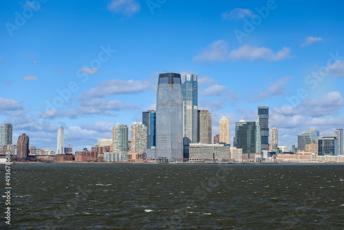 Views of Battery Park and the financial district from the water and Ellis Island in New York City