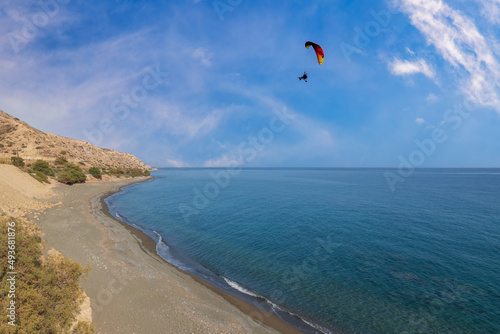 Fototapeta Naklejka Na Ścianę i Meble -  Summer landscape of Crete island in Greece in Europe. Coast in the Larapetra region. In the background is a sunny sky with clouds.
