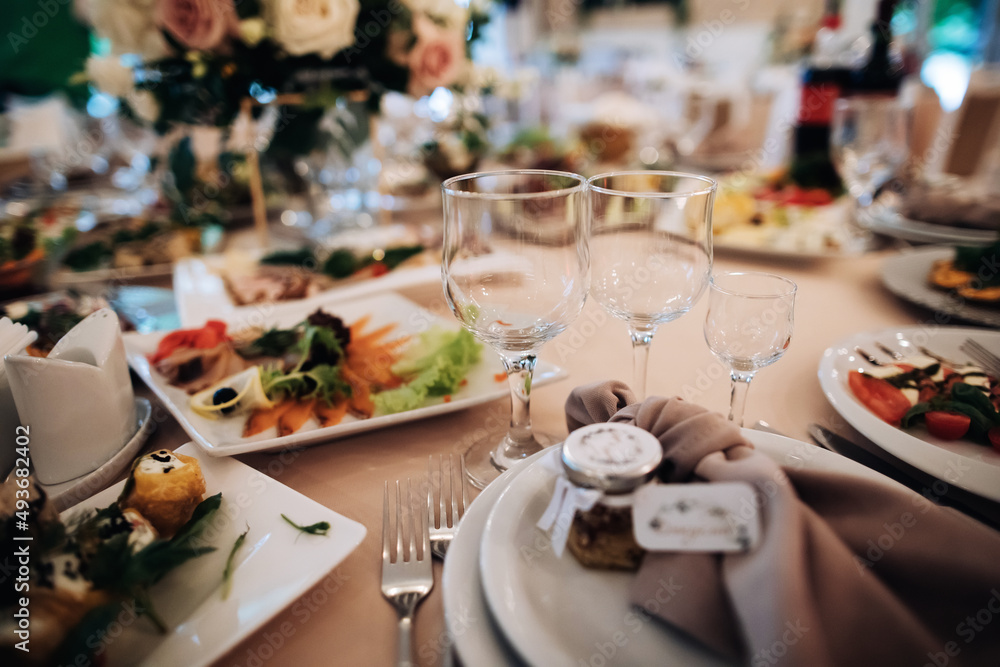 Empty wine glasses on the holiday table. Table with food Empty wine glasses on the holiday table. Table with food