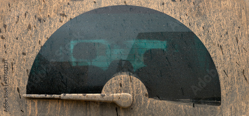rear window of a vehicle dirty by rain with mud