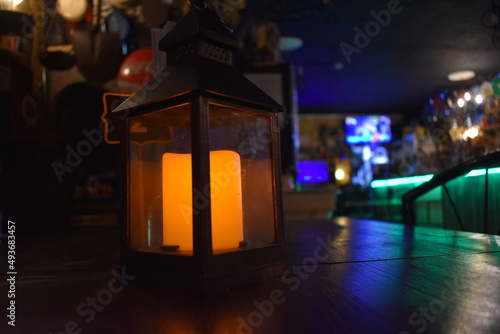 Candle lantern in rustic enviroment