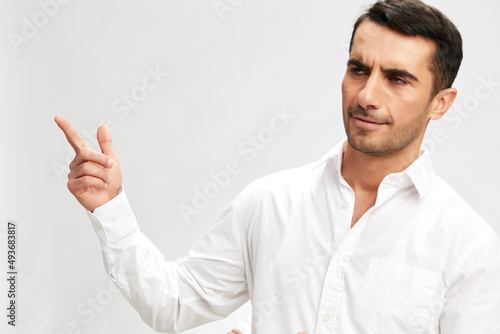 successful man in white shirts holding thumbs up copy-space self-confidence isolated background