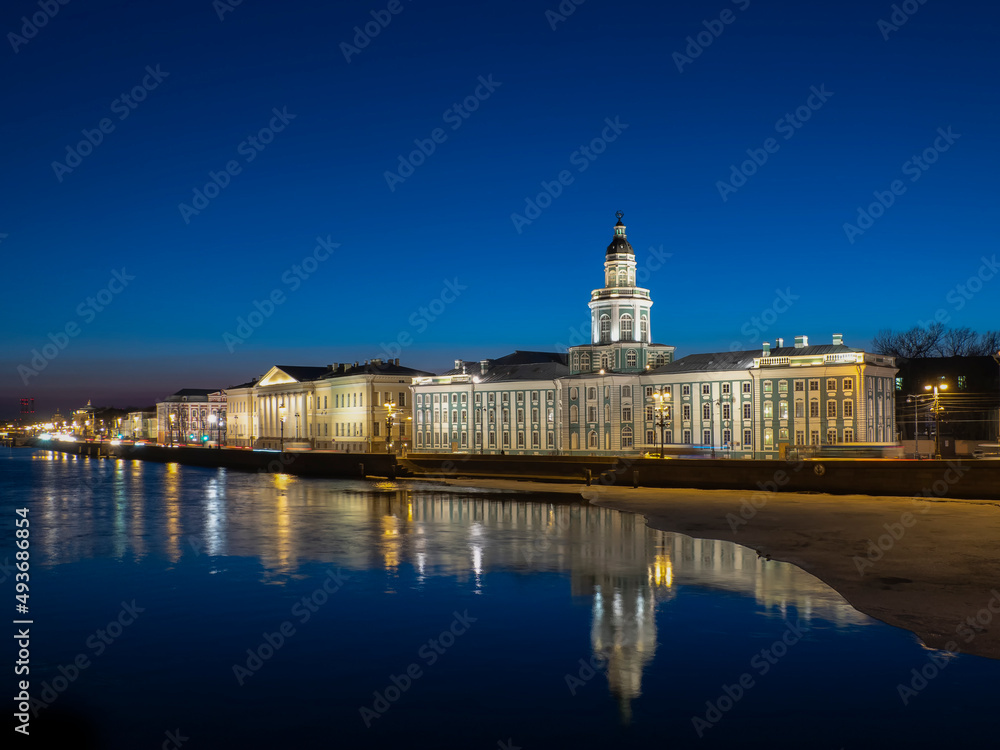 THe night view of the the Kunstkamera, kunstkammer museum, landmark building on Universitetskaya Embankment in Saint Petersburg, Russia