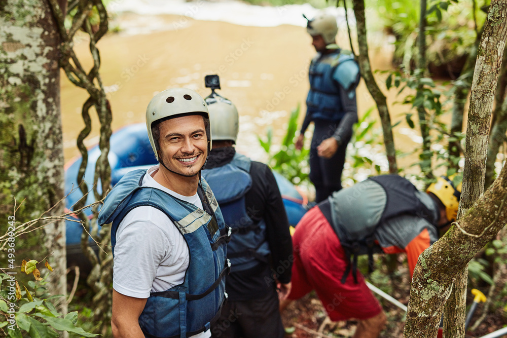 These moments are ones not easily forgotten.... Shot of a group of young friends white water rafting.