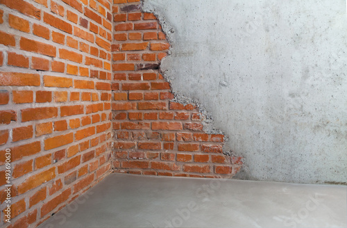 Obraz na płótnie MUR EN BRIQUE ET SOL EN BÉTON CIRÉ w salonie
