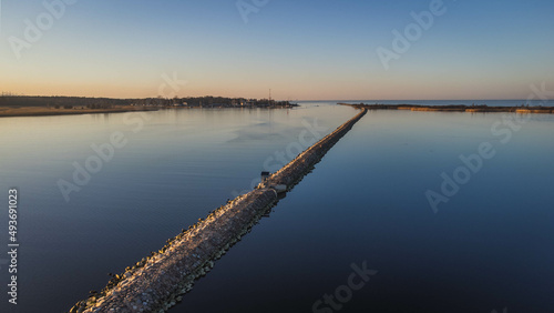 A stone dike in the "Ptasi Raj" reserve in Gdańsk. The view from the drone in the evening time.