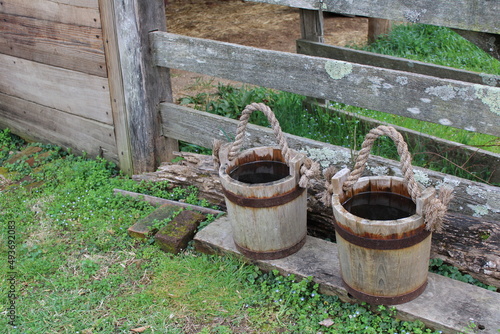 A pair of buckets filled with water photo