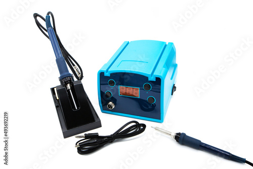 Heat adjustable soldering iron isolated on a white background. Induction soldering station, heating control regulator and soldering iron. photo